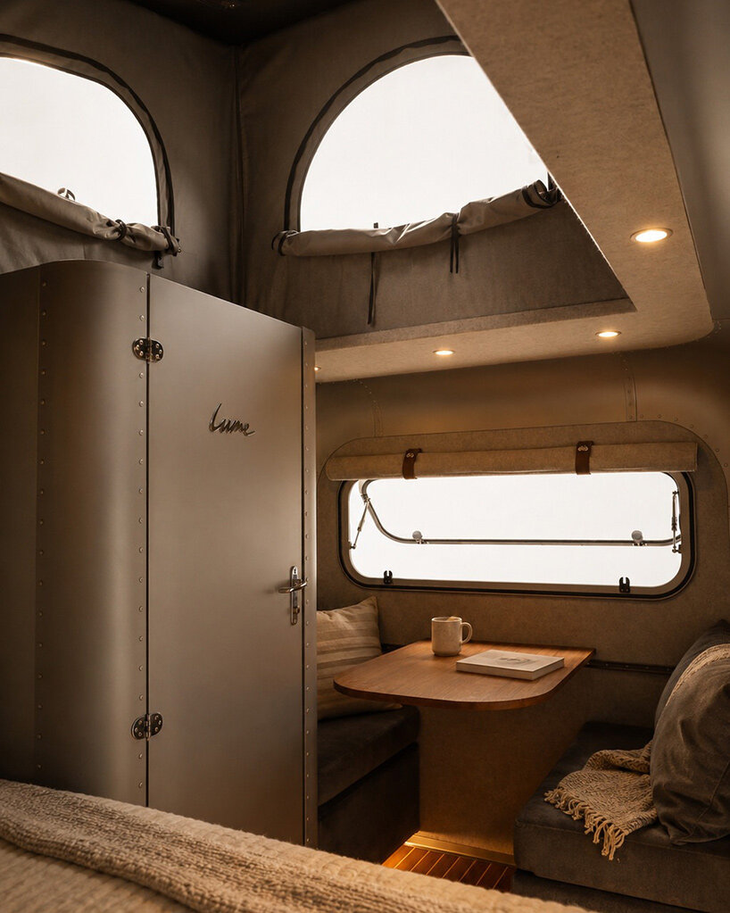lume traveler’s lightest caravan hides a pull-out kitchen in its aluminum shell